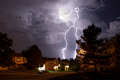 Photo of a storm at night with lightening striking