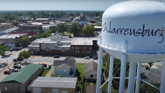 image of the warrensburg, mo water tower in the foreground with warrensburg behind